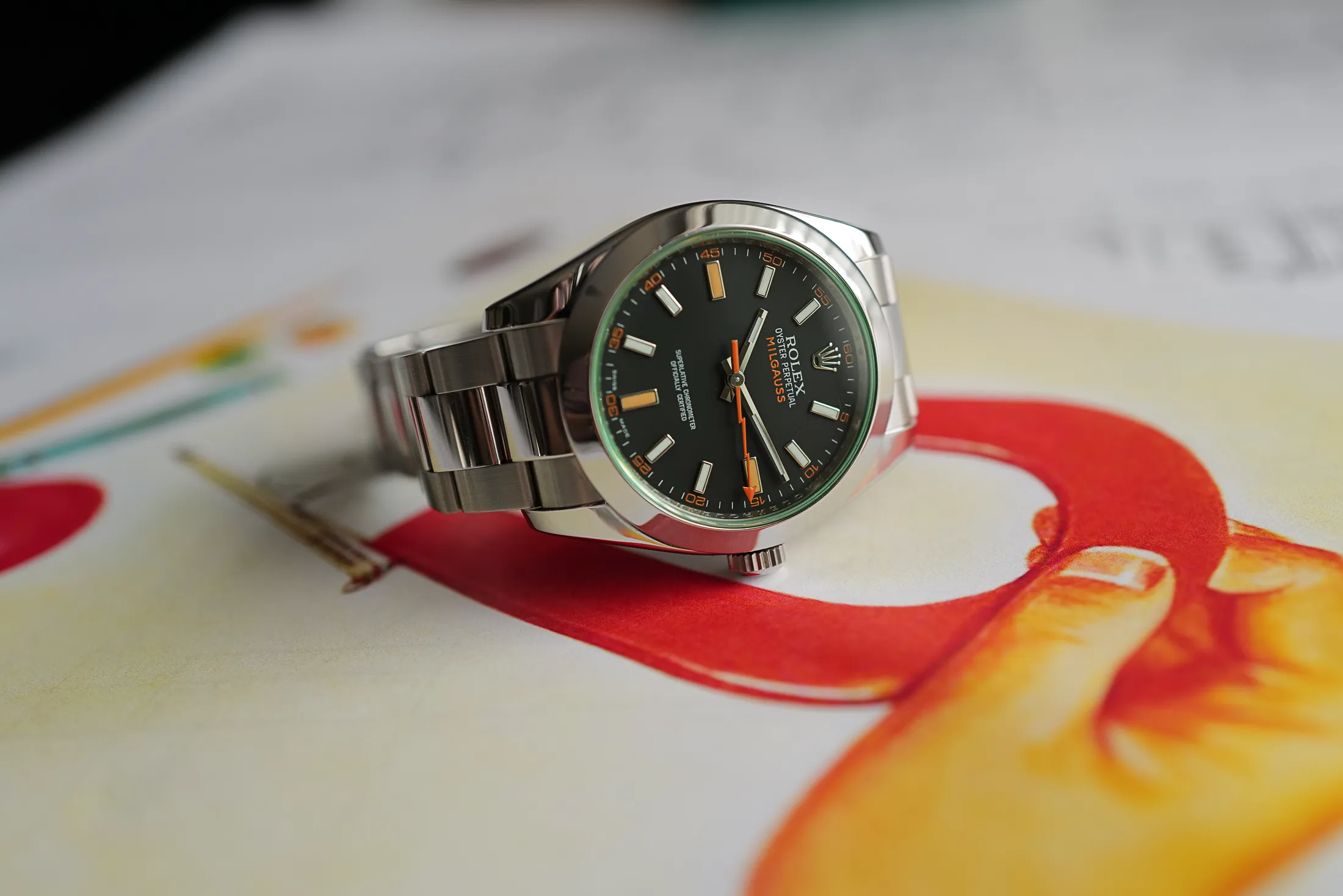 Milgauss superclone laid flat – full view emphasizing case, bezel, and dial symmetry.