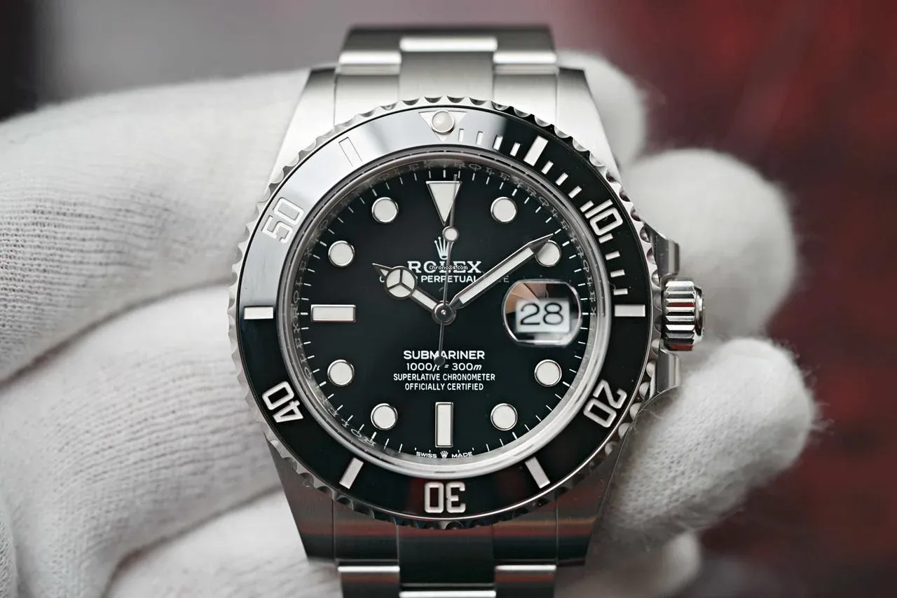 Authentic Rolex Submariner Date 126610LN held by gloved hands, showing crisp dial, cyclops, and ceramic bezel—benchmark for comparison against superclones.