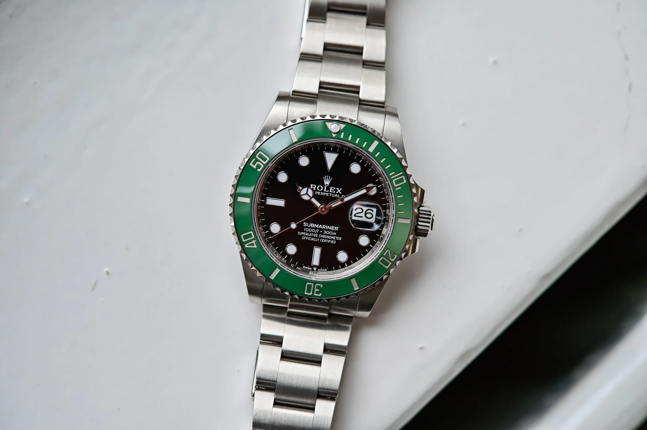 VSF Submariner 126610LV on wrist, showcasing green bezel and black dial.