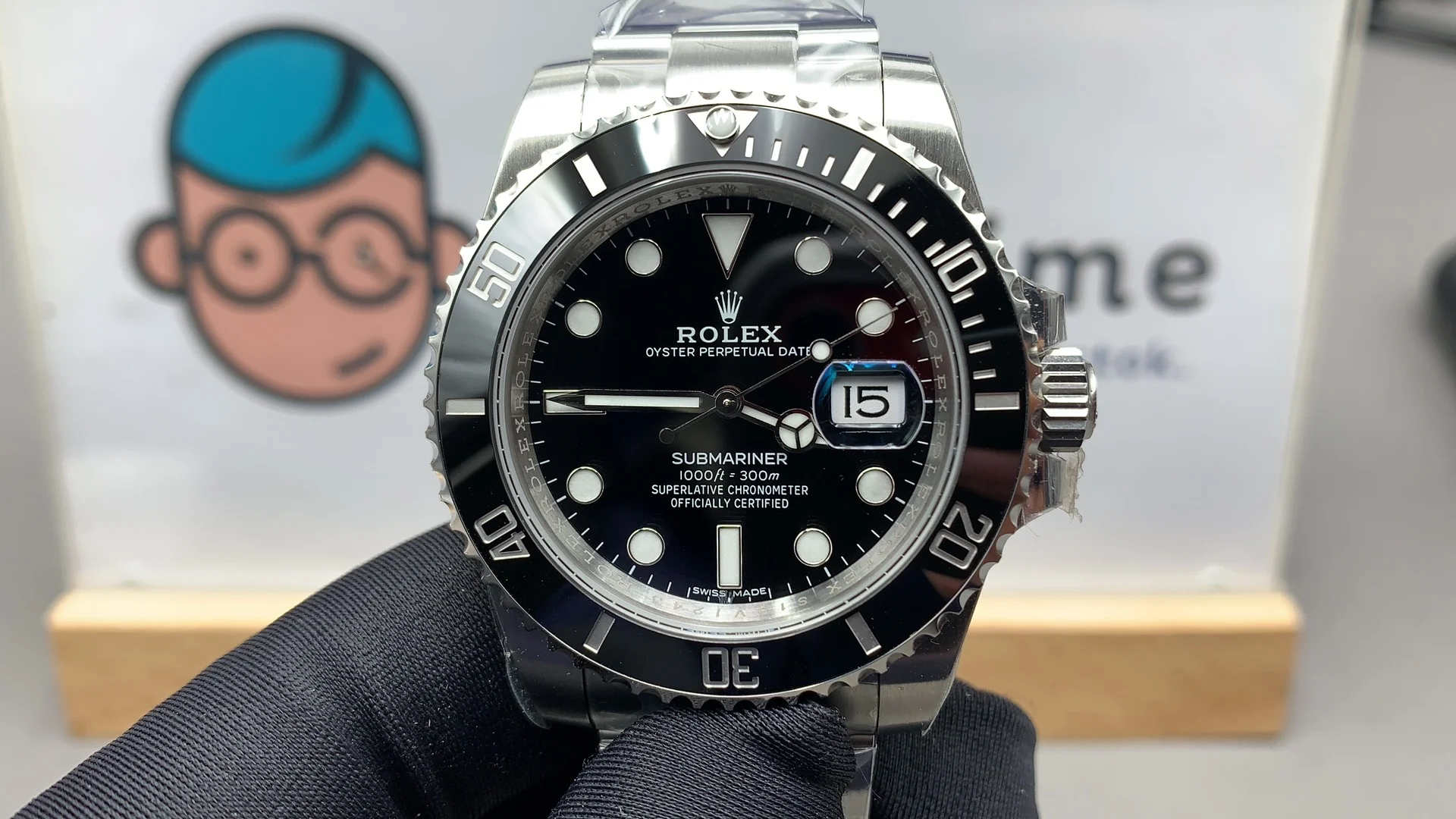 Front view of VSF Submariner 116610LN with black bezel and dial, held against a light background.