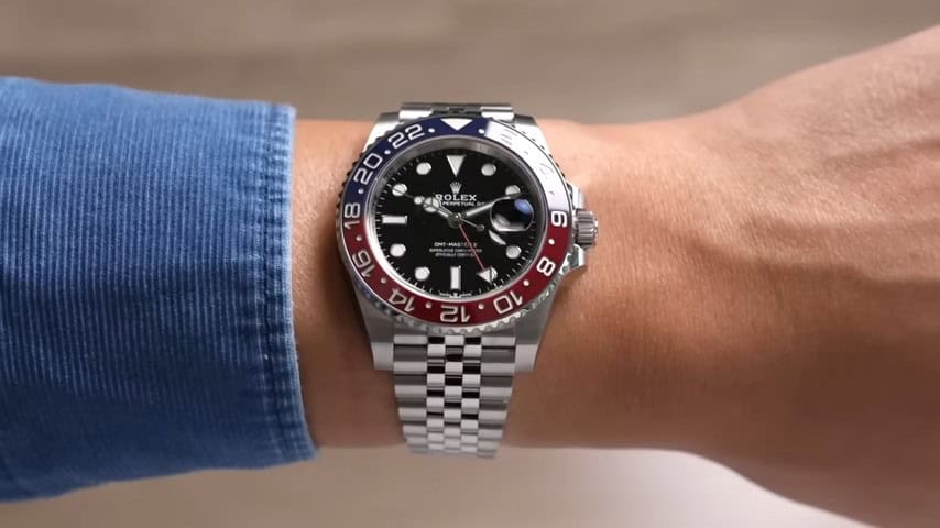 Close-up side profile of superclone GMT-Master II Pepsi on wrist, emphasizing case thickness and lug-to-lug fit.