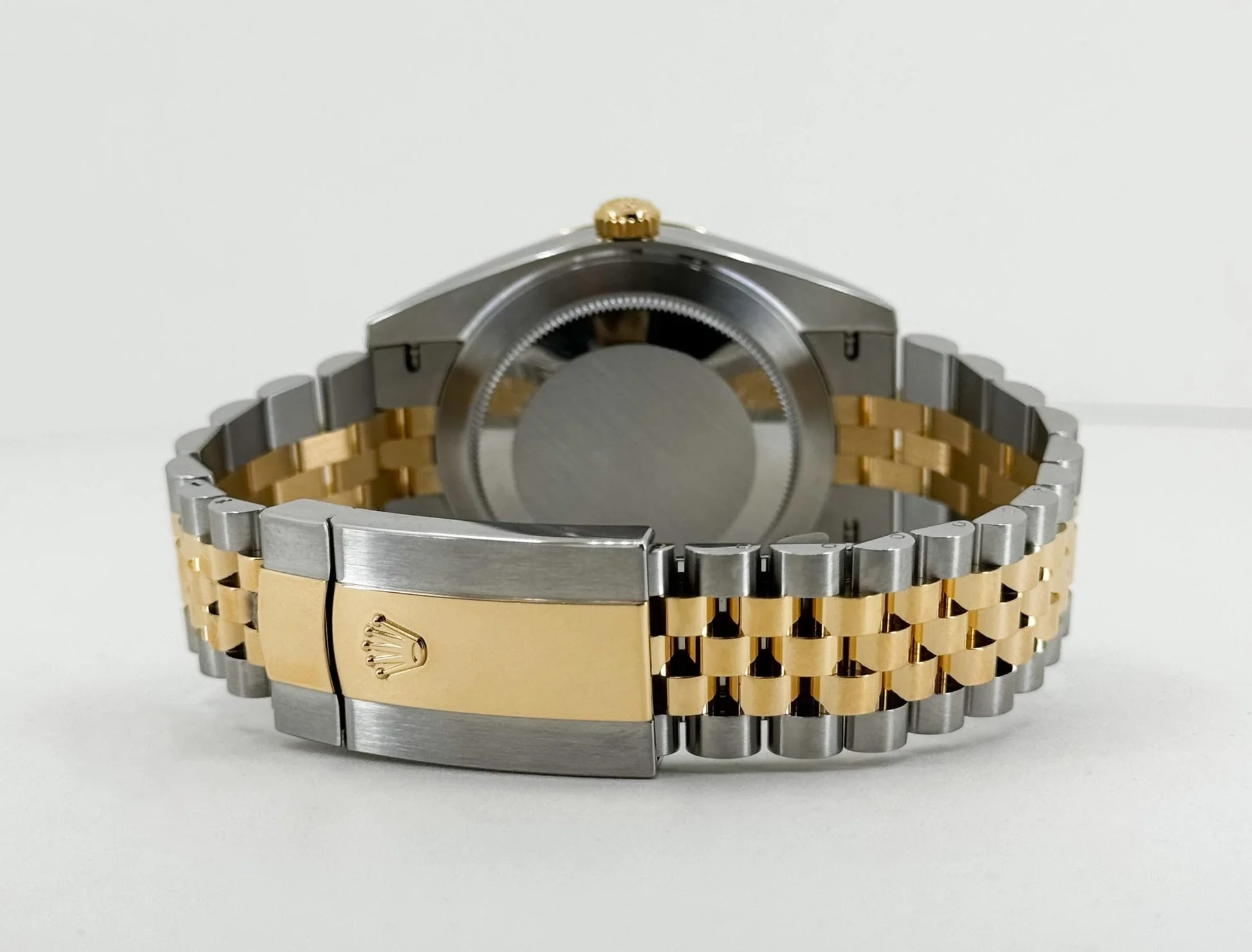 Rear view of superclone Rolex Datejust 41mm showing caseback engraving and two-tone Rolesor bracelet clasp.