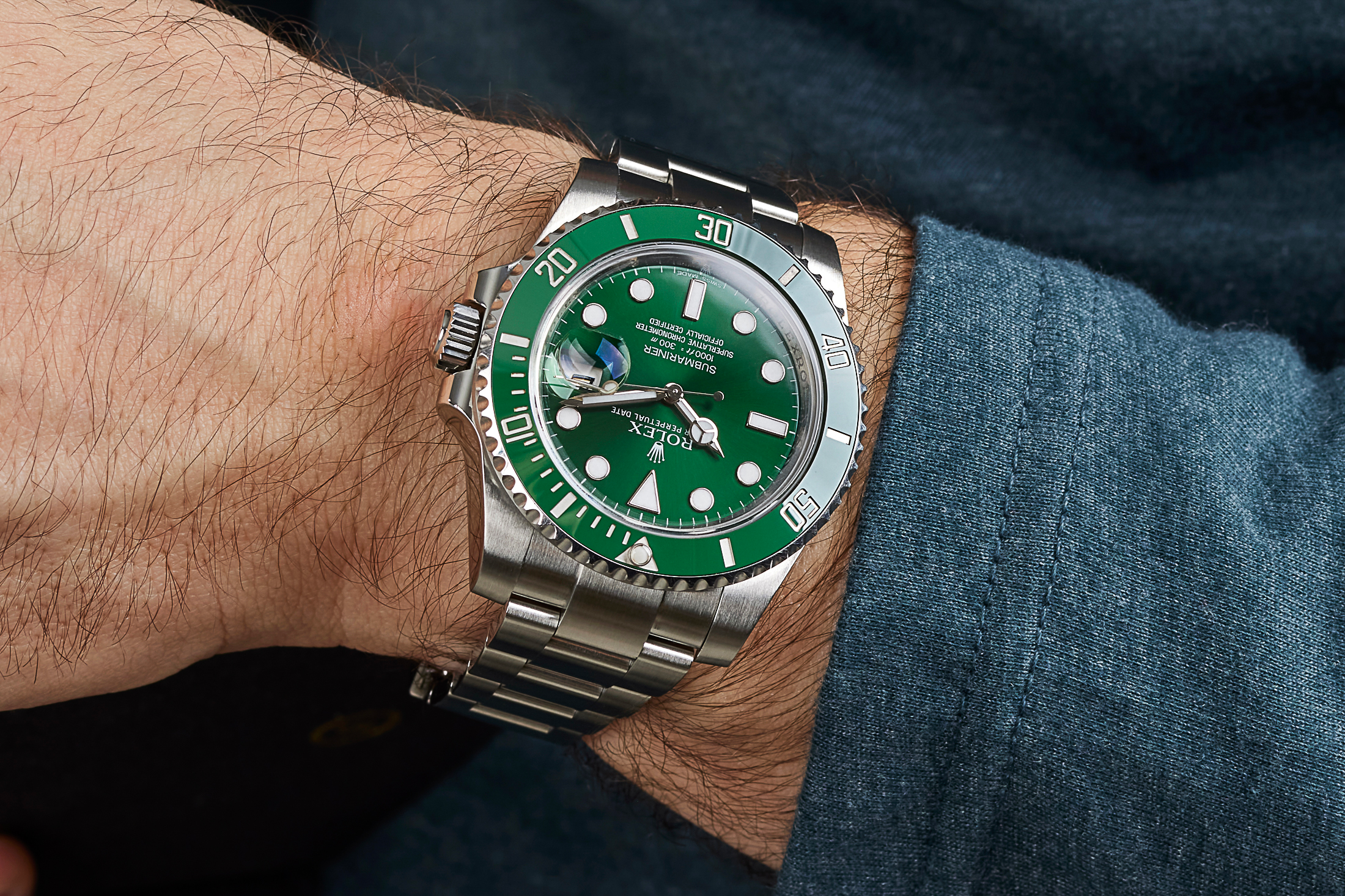 Rolex 'Hulk' Submariner on wrist denim shirt