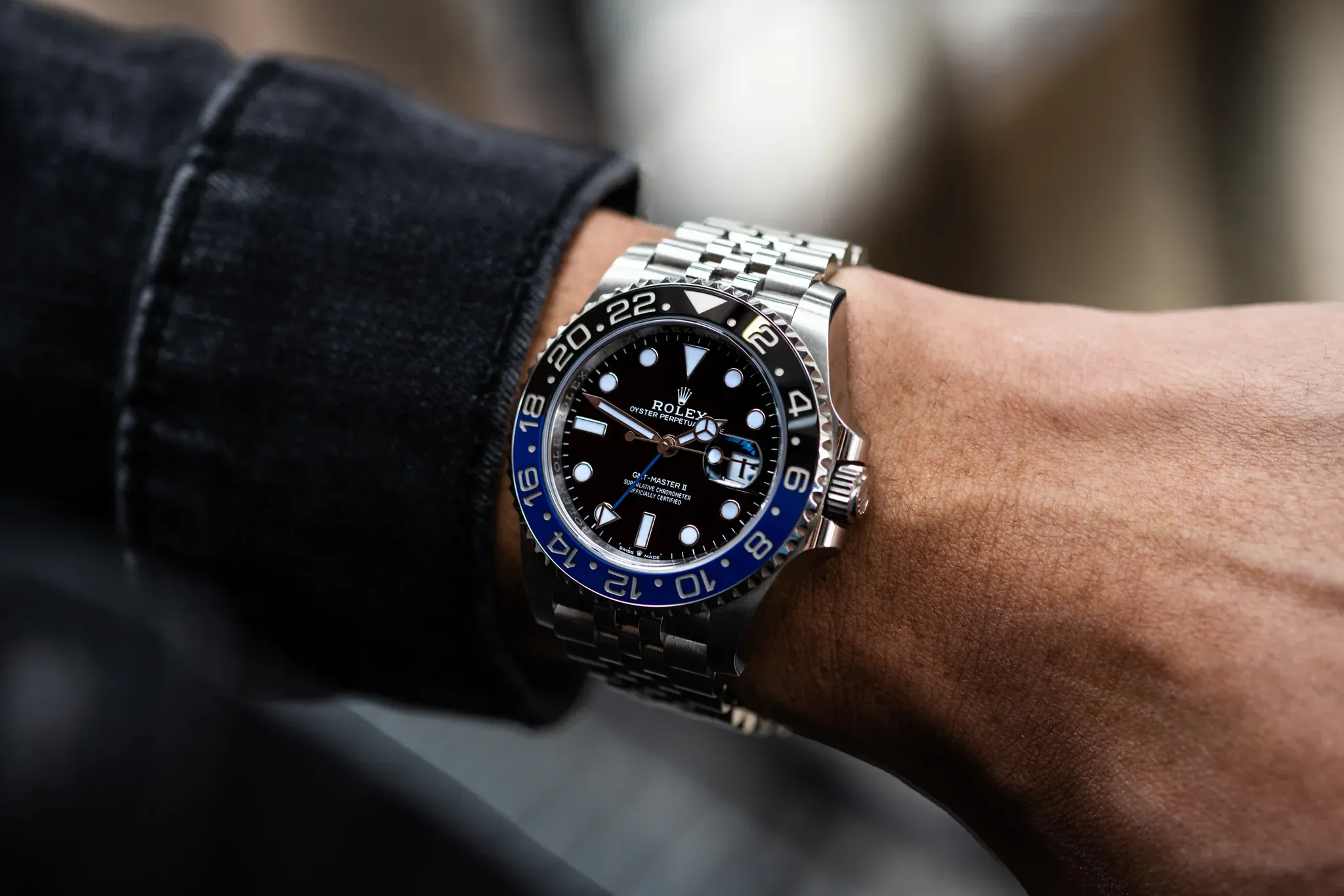 High-resolution photo of Rolex GMT-Master II superclone on wrist demonstrating natural wear and bezel contrast.