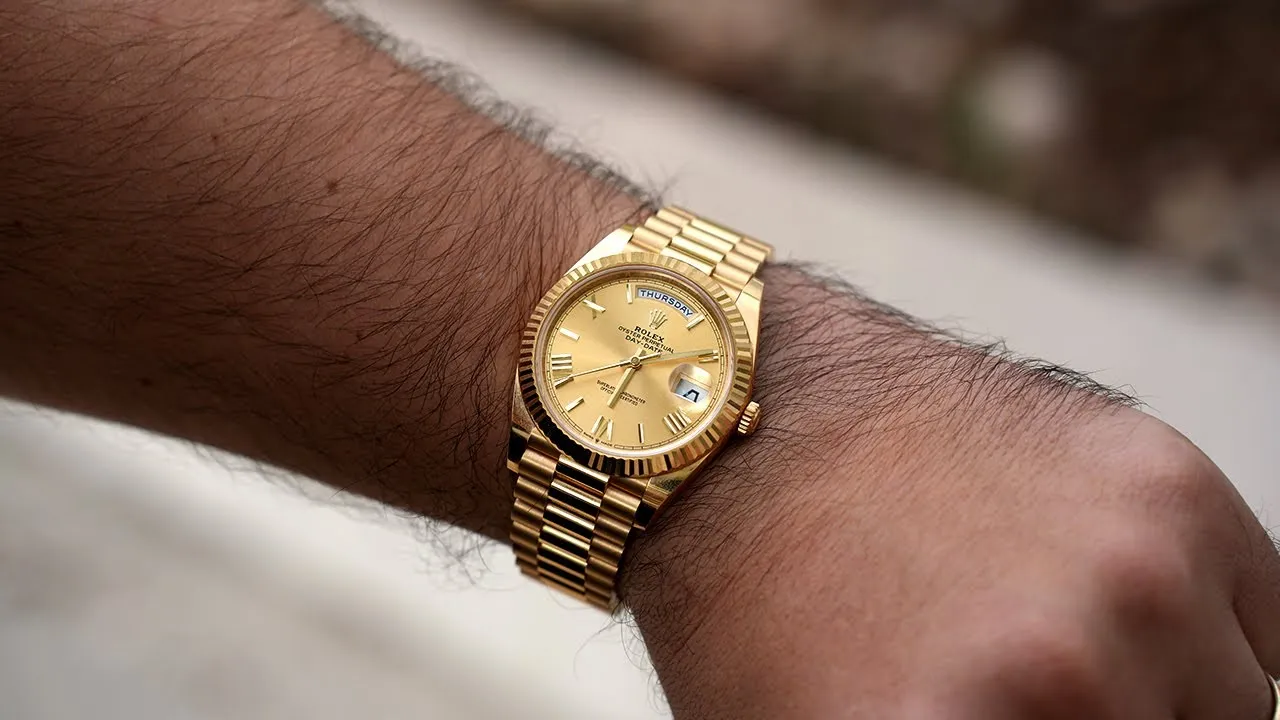 On-wrist view of the 2026 Rolex Day-Date President superclone in yellow gold with champagne dial and iconic President bracelet.