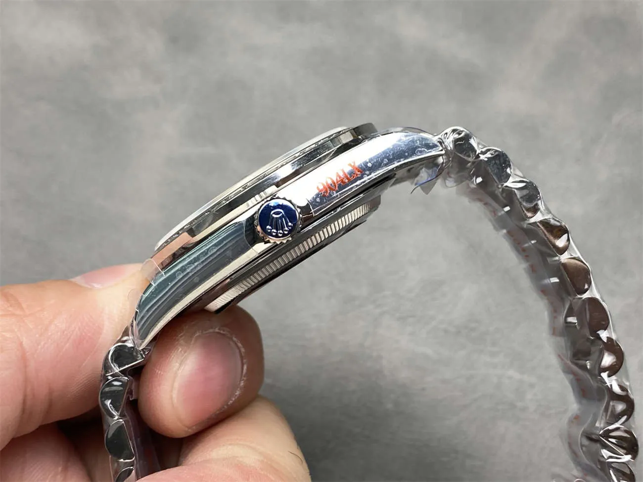 Side view highlighting case thickness, lug design, and bracelet fit on the Day-Date President superclone.